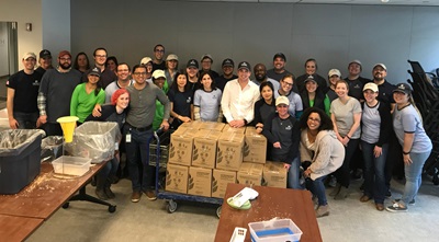 Employees assembled meals for Rise Against Hunger